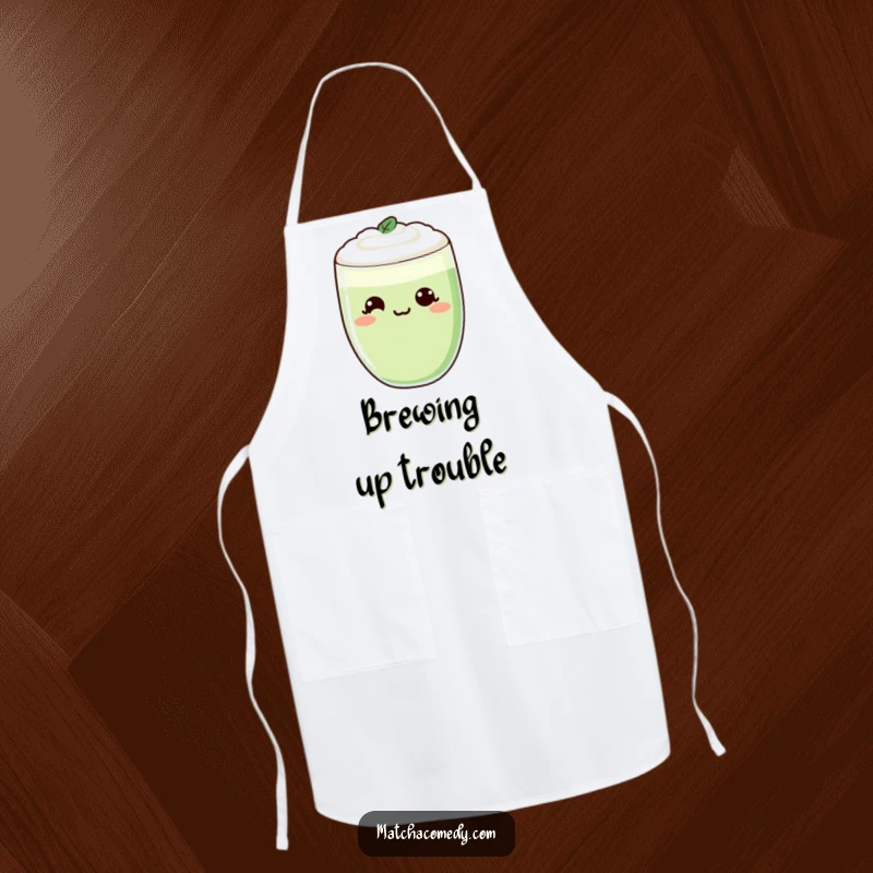Funny Kawaii Matcha Latte Apron with a cheeky smirk, worn by a chef, protecting clothes humorously.