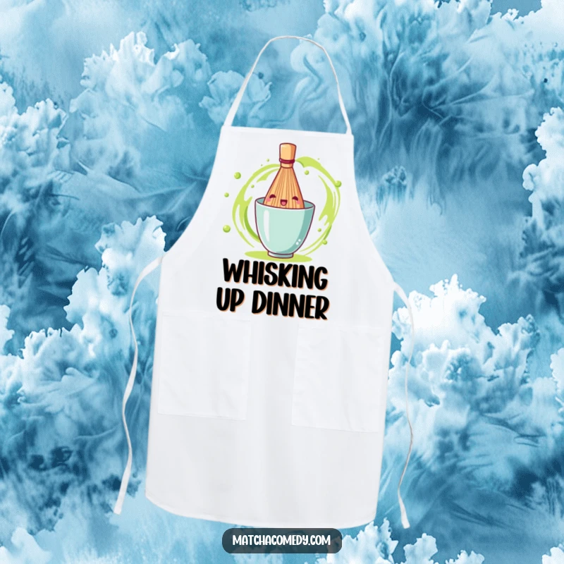 Funny matcha tea whisk shown spinning with gusto, making this apron a cheerful addition to any cooking ensemble.