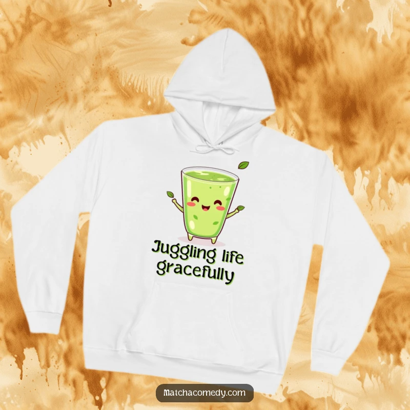 Funny Kawaii Matcha Juggling Hoodie: A happy matcha beverage wearing a smile, juggling tea leaves.