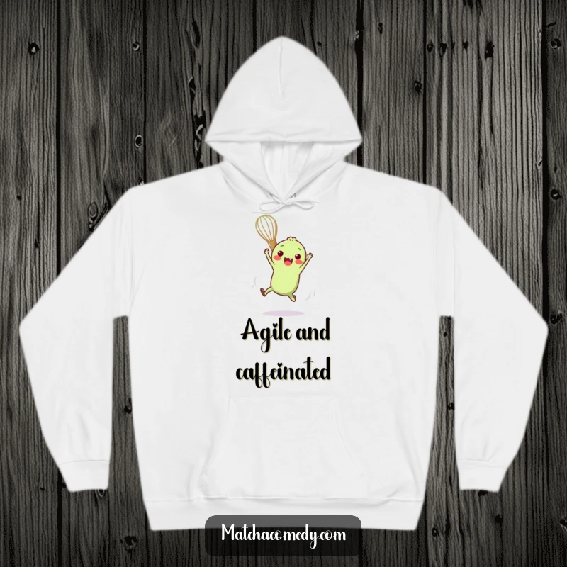 Funny hoodie featuring a small, anthropomorphic matcha whisk performing a delightful and amusing acrobatic maneuver with enthusiasm.