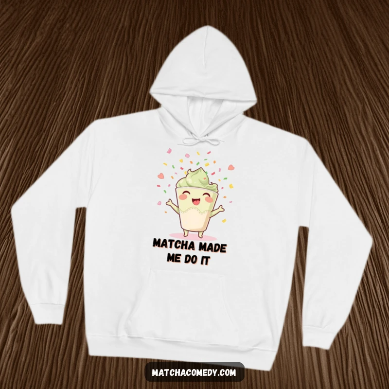 Funny joyful matcha cup hoodie, throwing confetti with delight, cozy apparel for celebratory moments.