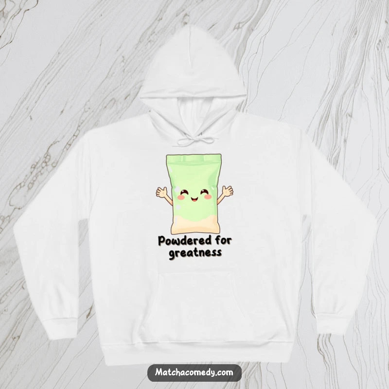 Funny matcha powder bag with arms waving happily, featured on a soft, warm hoodie. A cheerful and comforting garment.