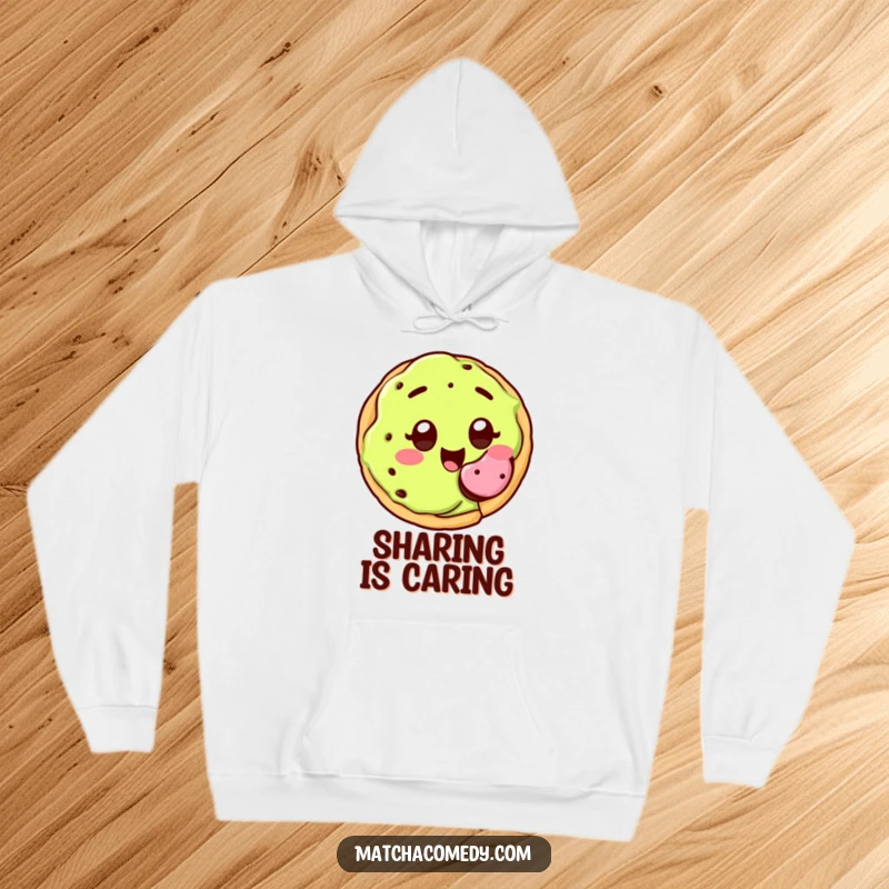 Funny kawaii matcha cookie with wide, joyful eyes, happily offering a bite, hoodie.