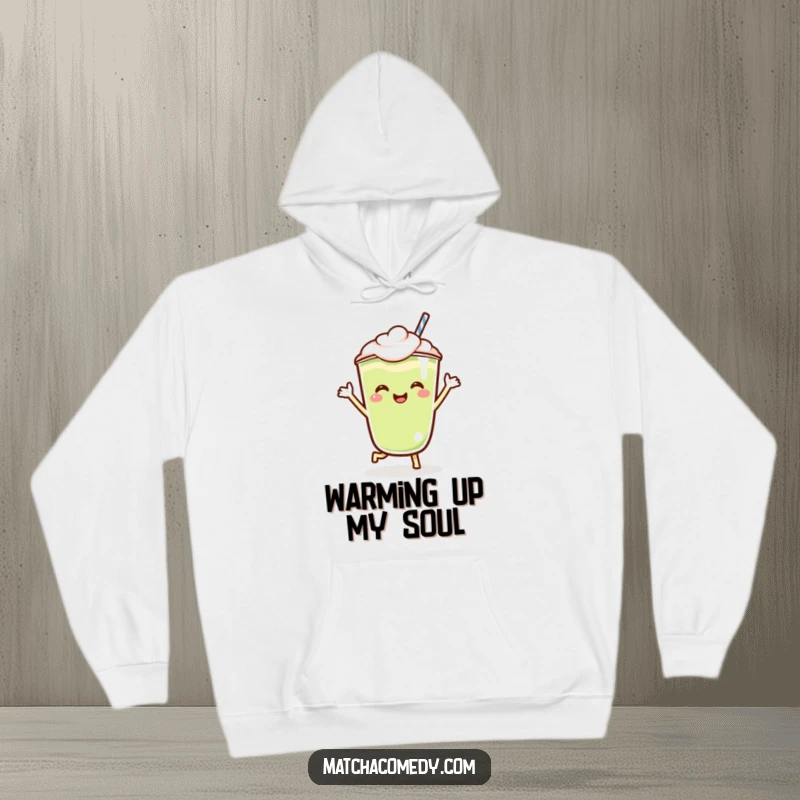 Funny Kawaii matcha latte hoodie featuring a happy, jigging character, designed for ultimate comfort and a touch of playful cheer.
