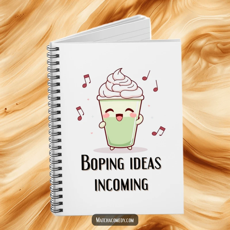 Funny matcha latte cup bobbing rhythmically to music on the cover of this notebook, inspiring creativity.